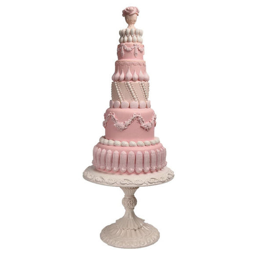 December Diamonds Large Pink Tiered Cake On Pedestal.